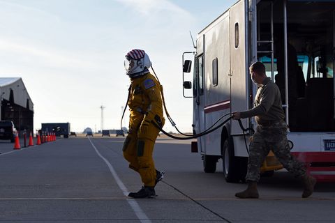 us air force maj “vudu”, u 2 dragon lady pilot for the 9th reconnaissance wing, enters the cockpit while a 9th physiological support airman assists him at beale air force, california, dec 15, 2020