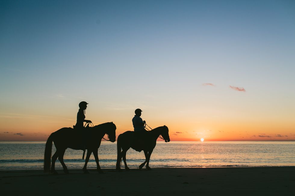 Sunset horseback riding on Turtle Island in Fiji