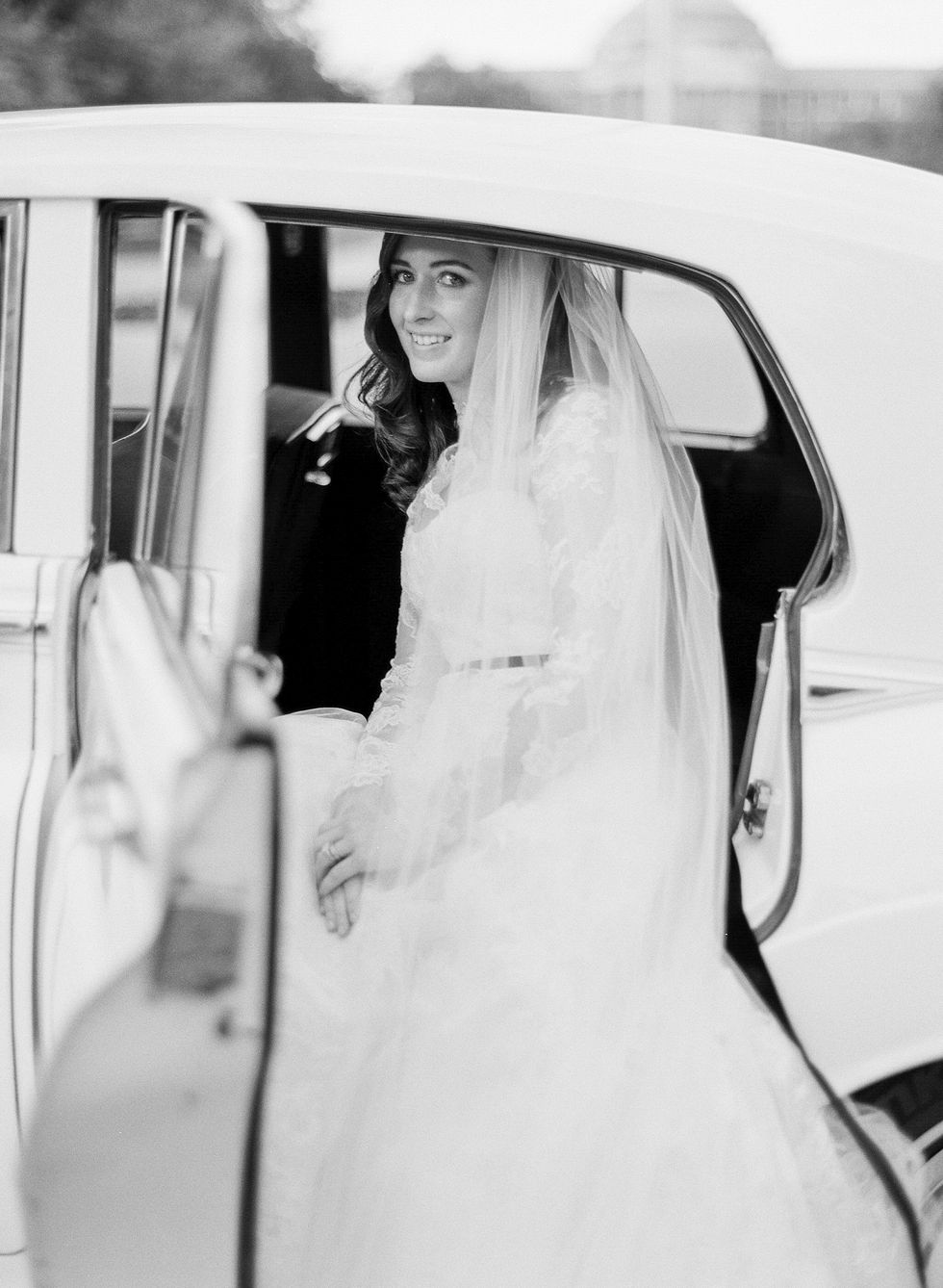 Photograph, White, Motor vehicle, Bride, Dress, Wedding dress, Black-and-white, Bridal clothing, Gown, Automotive design, 