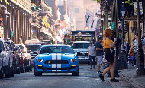 Land vehicle, Vehicle, Car, Transport, Street, Yellow, Urban area, Shelby mustang, Road, Sports car, 