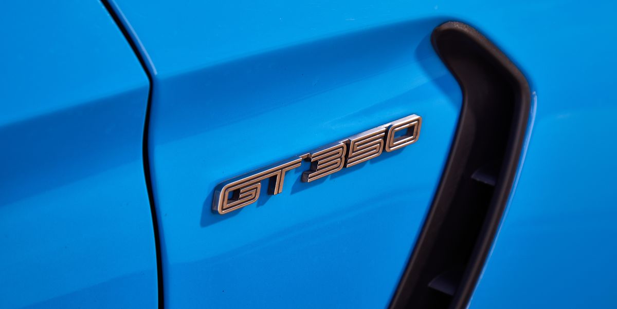 Blue, Vehicle, Car, Electric blue, Hood, Vehicle door, Emblem, Muscle car, 