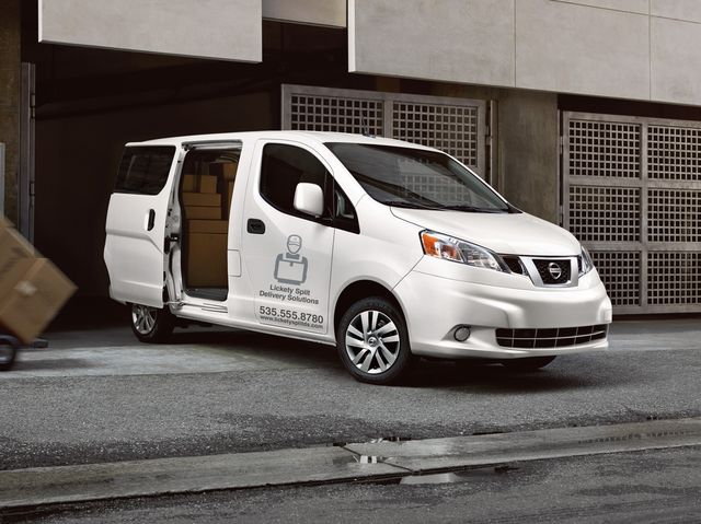 2018 white nissan nv200 van being loaded with cargo boxes