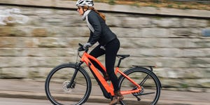 woman on orange ebike