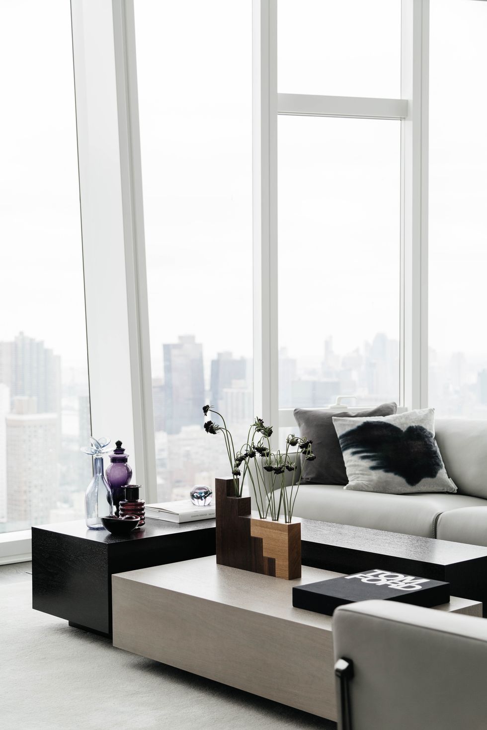 living room, wooden art, grey couch, new york city, large windows