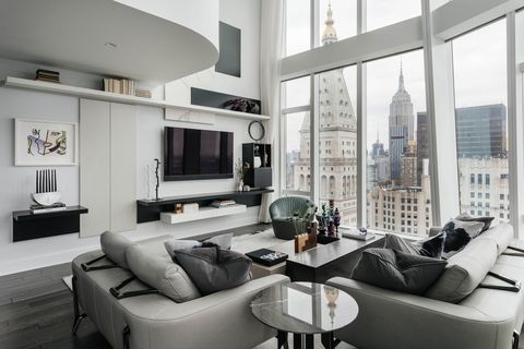 white apartment, black finishings, grey couch, nyc, new york city