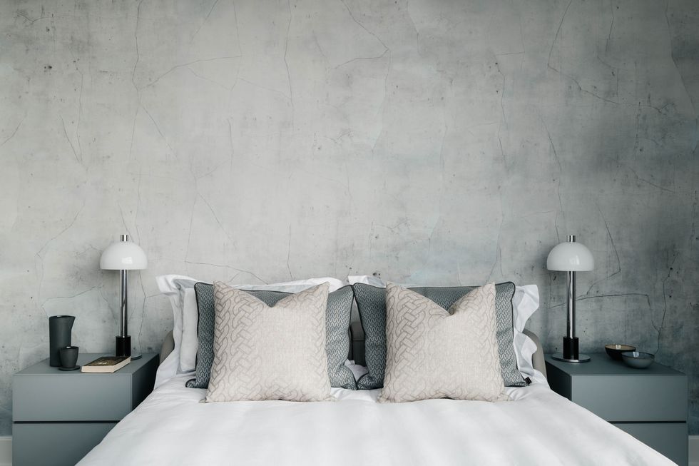 bedroom, white linen, stone wall