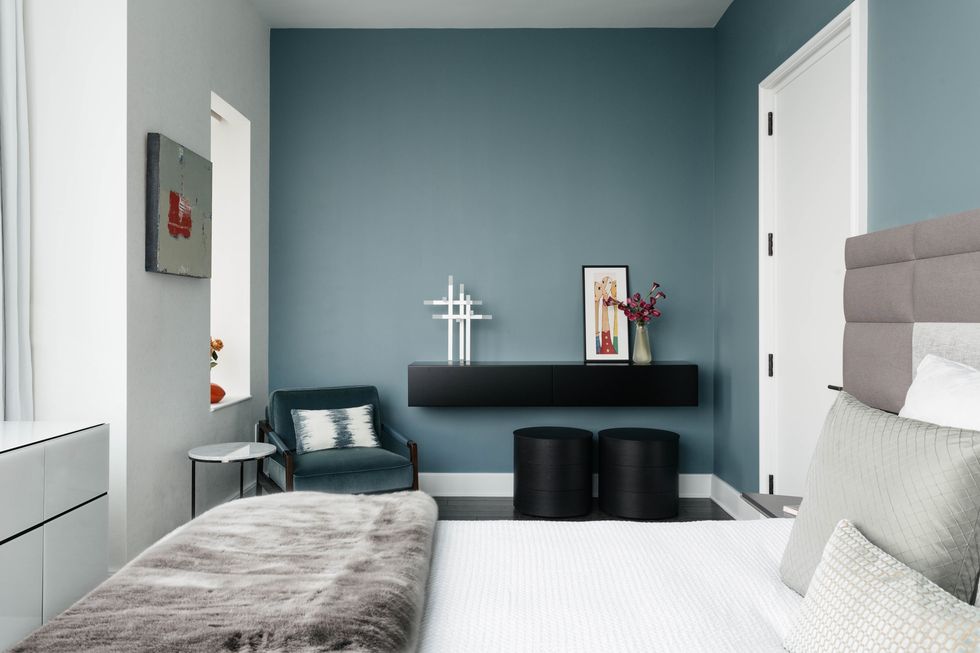 bedroom, green blue wall, black shelving