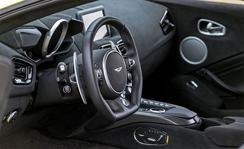 Land vehicle, Vehicle, Car, Steering wheel, Center console, Luxury vehicle, Steering part, Personal luxury car, Gear shift, Automotive design, 