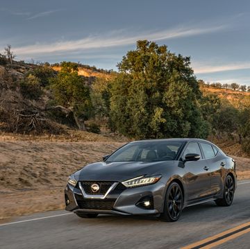 2022 nissan maxima driving down a country road