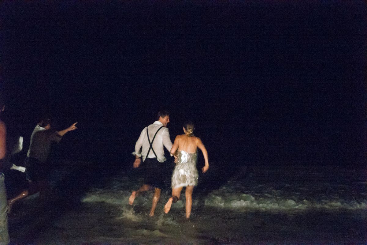 the couple running into the ocean