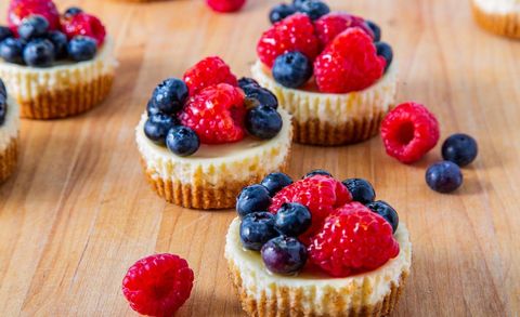 cheesecake cupcakes with mixed berries on top