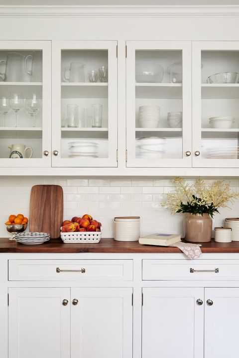 white kitchen cabinets, silver knobs,