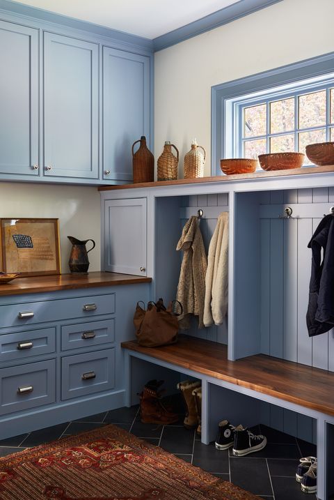 mudroom with bench and built in drawers and cabinets