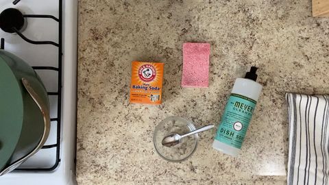 cleaning supplies on granite counter