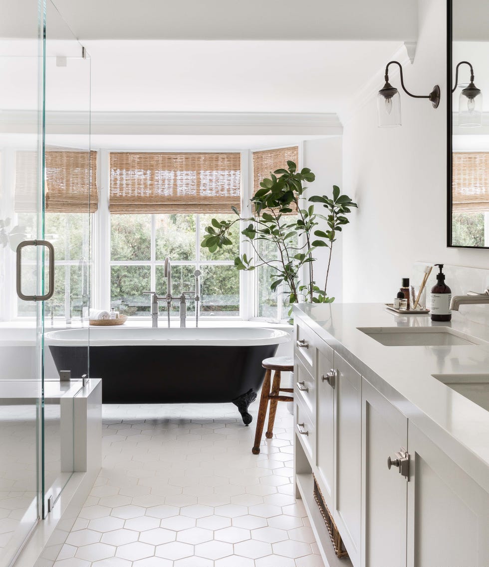 modern bathroom with a freestanding bathtub and large windows