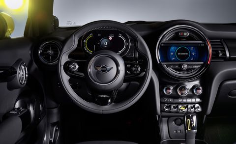 Vehicle, Steering wheel, Car, Steering part, Center console, Speedometer, Automotive design, Auto part, Mini, Plant, 