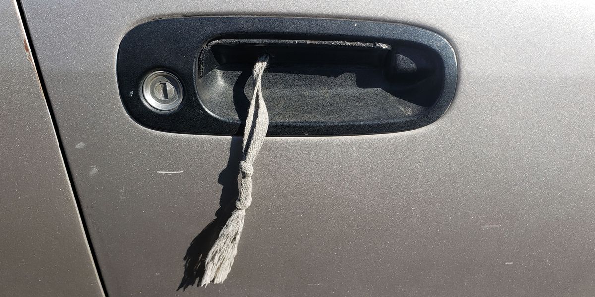 With Just a Shoelace and a Knife, Fixing a Broken Car Door Handle