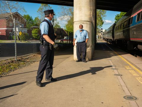 amtrak employees chat during a train stop in charlottesville, virginia on may 11, 2020