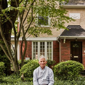 dr anthony fauci outside of a brick house