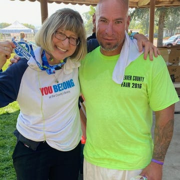 carrie kelley left and fidel ybarra right stand together for a photo after they finished the marathon carrie kelley left and fidel ybarra right stand together for a photo after they finished the marathon