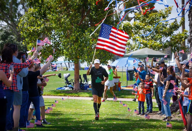 20210531mikerouse31four31four31may 31, 2021, coronado, ca  mike rouse crosses the finish line and becomes emotional after his 31 miles in 31 consecutive days run,  at glorietta park in coronado, to honor the lives of 31 navy seals who were killed in 2011 when the helicopter they were flying in was shot down in afghanistanthe run was to raise money for the boot campaign charity, to help veterans