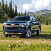 2023 blue chevrolet silverado 1500 high country in a mountain valley