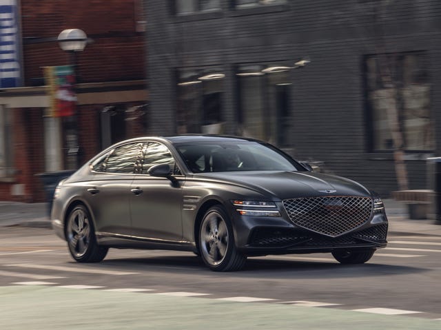 2023 genesis g80 sport driving through downtown