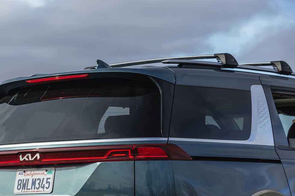 kia carnival with factory roof rails and crossbars