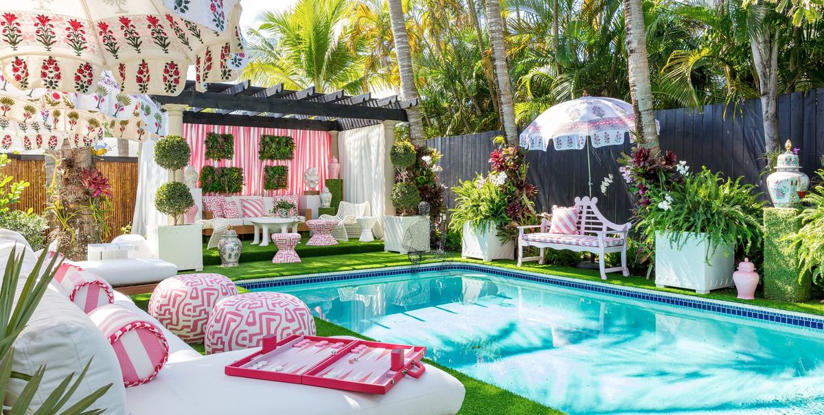 the janie molster–designed poolside lounge in a variety of pink florals and stripes at the 2022 kips bay show house 2022 © nickolas sargent