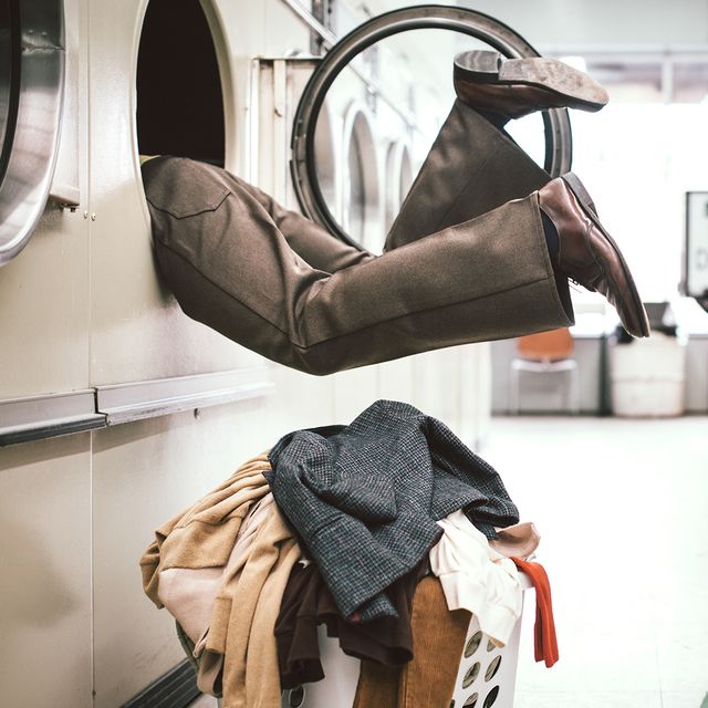 appliance repair technician person stuck in dryer