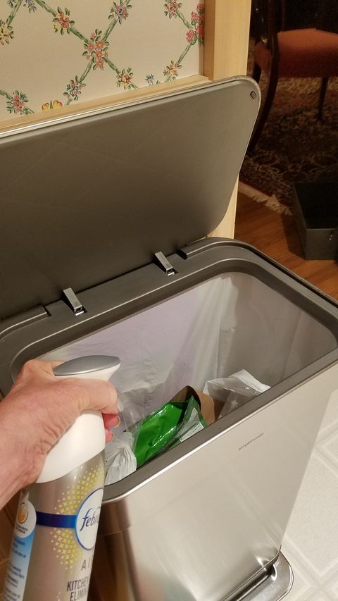 testing febreze kitchen odor eliminator in a trash can