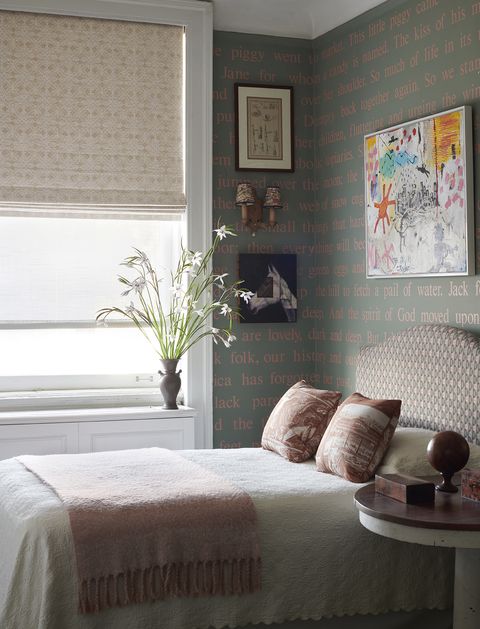 a guest bedroom with graphic wallpaper in a harlem home