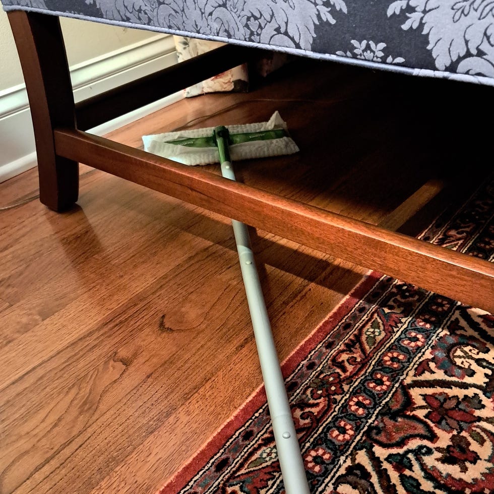 Best Mops - Testing a Swiffer mop under low furniture testing a swiffer mop under low furniture