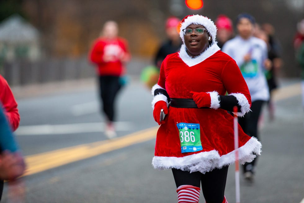 runners in the jingle all the way race dressed in santa costumes