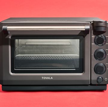 a small oven with a black knob