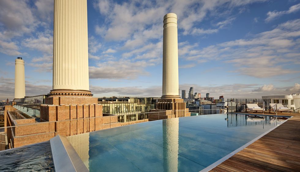 a pool with a tall tower in the background