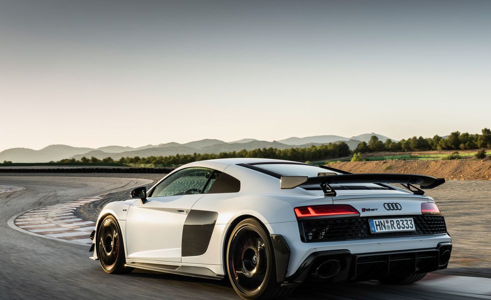 2023 audi r8 gt driving around a racetrack