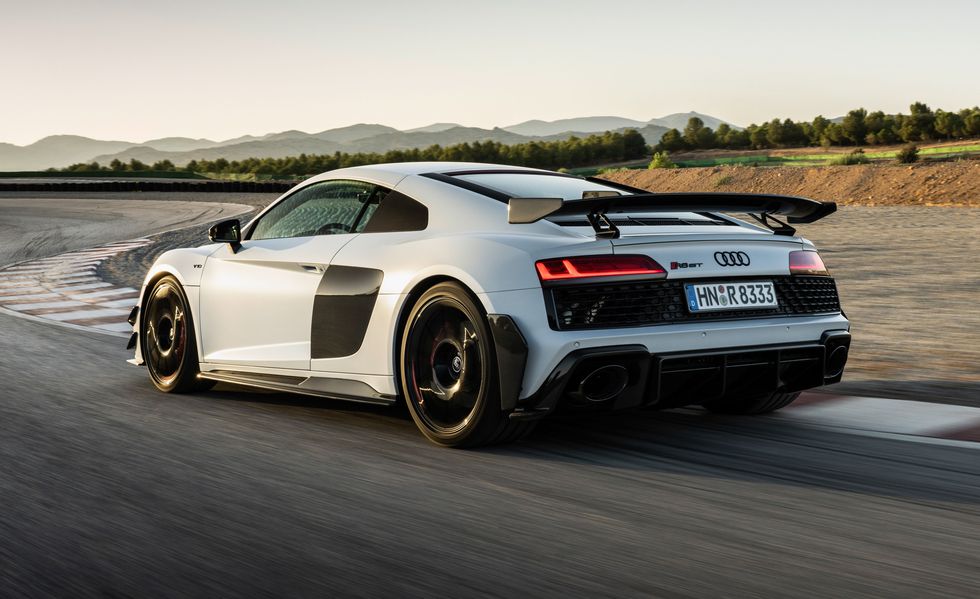 2023 audi r8 gt driving around a racetrack