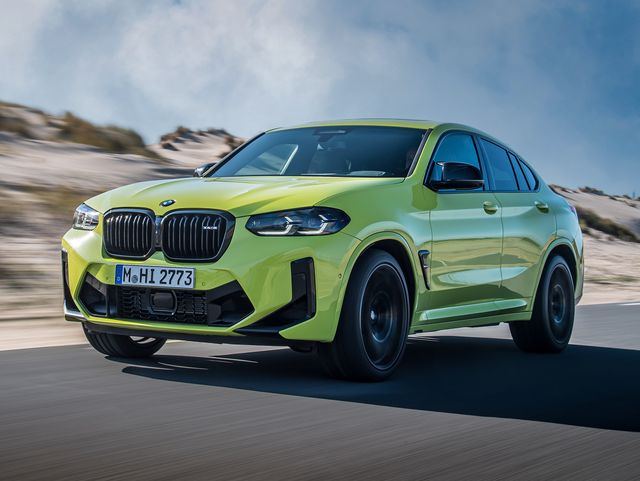 2023 bmw x4 m competition suv driving a coastal highway