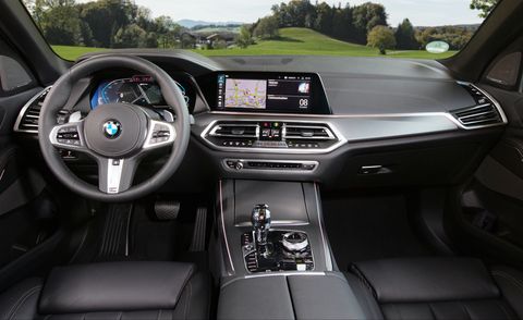 black interior of a 2023 bmw x5 overlooking rolling meadows