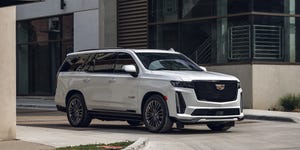 2023 cadillac escalade v in white parked in an alley