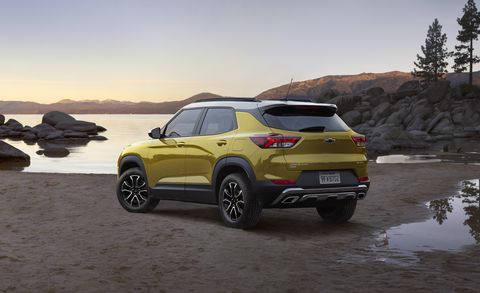 the 2023 trailblazer finished in nitro yellow parked with shallow lake in background