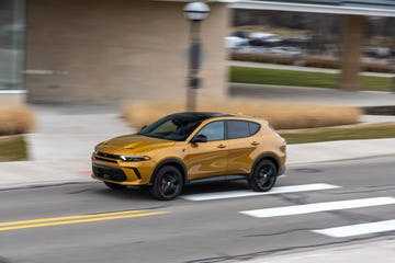 a yellow car on a road