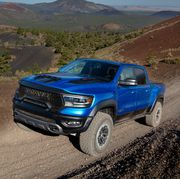 2023 ram 1500 trx off roading over a hill