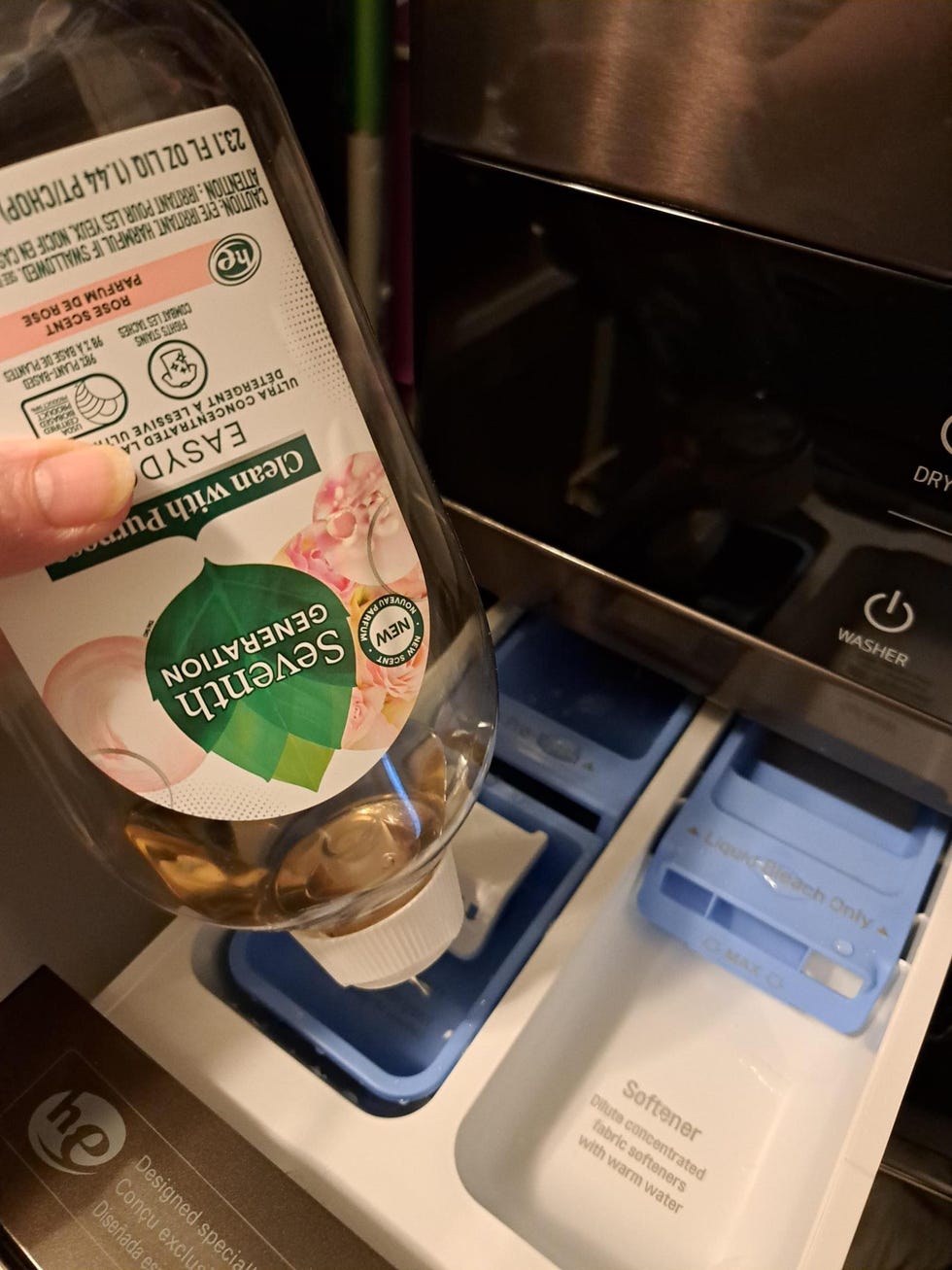 tester adding ecofriendly detergent to a washing machine dispenser