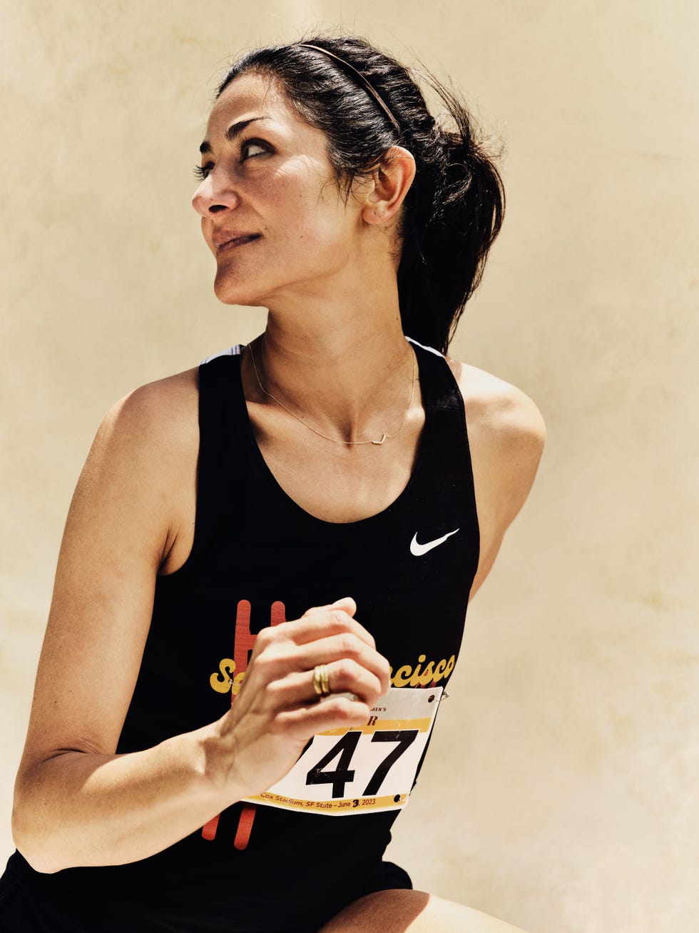 a portrait of a runner against a neutral white background