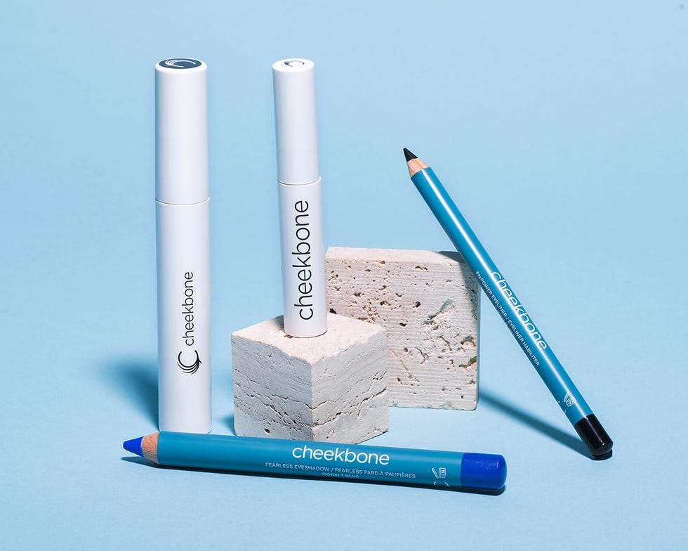 makeup product shot, including eyebrow gel, mascara and eyeshadow pencil
