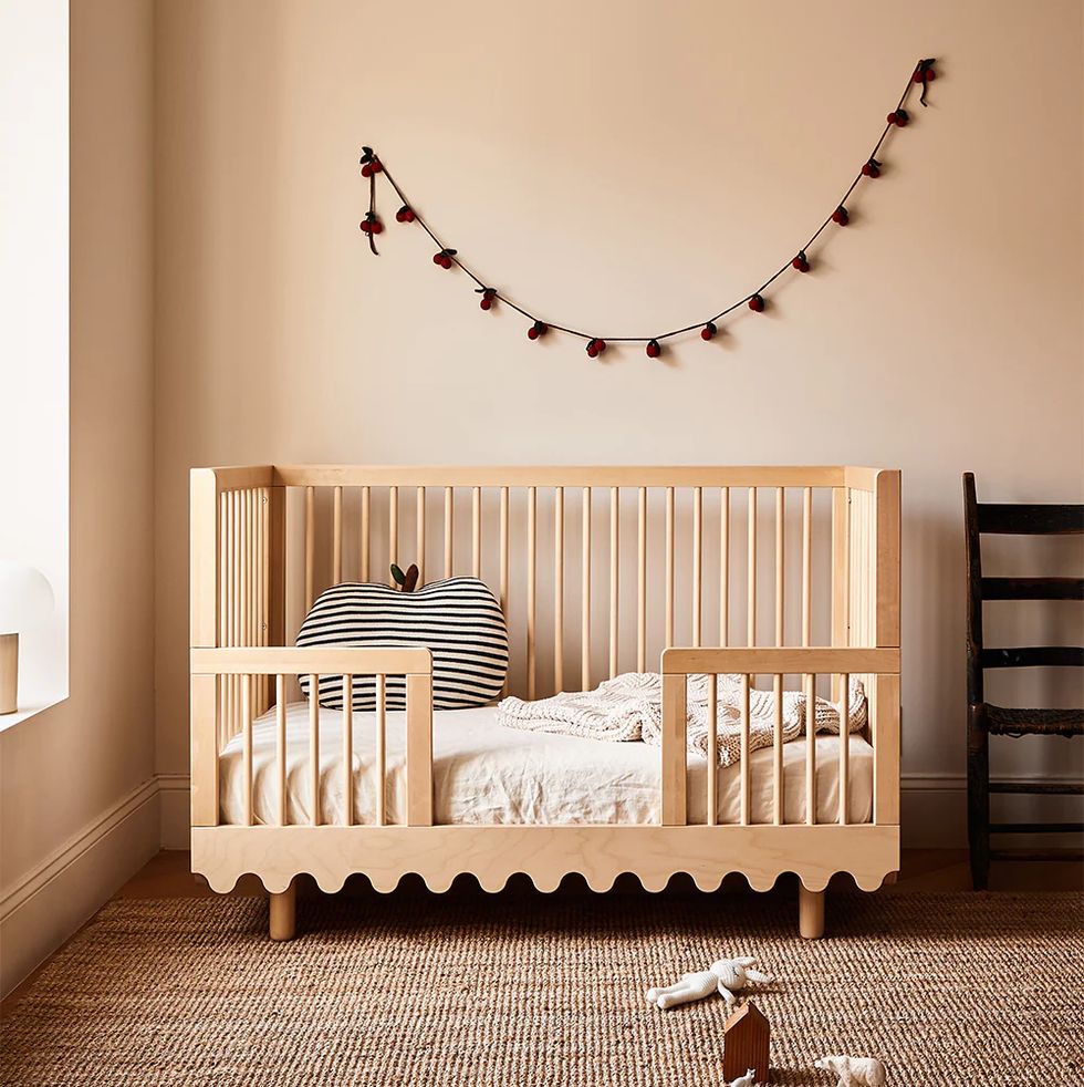 a baby crib with a reindeer head