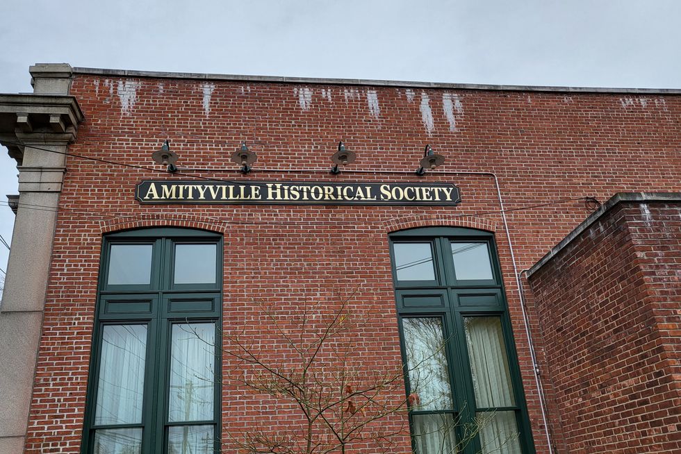 exterior of brick amityville historical society building