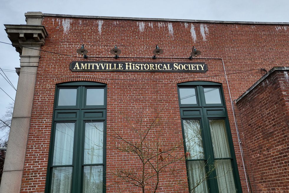 exterior of brick amityville historical society building